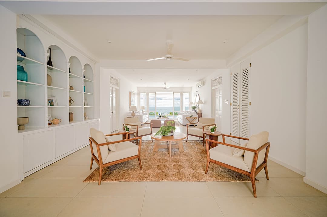 Mirissa luxury villa corridor with arched display niches and ocean view