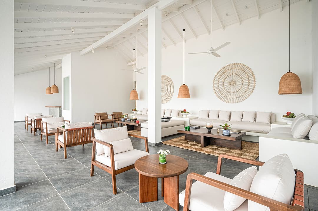 Mirissa luxury villa dining pavilion with rattan pendants and white tables