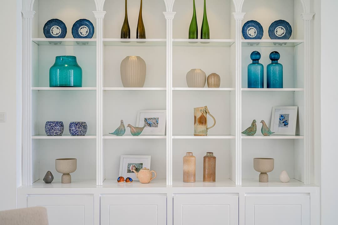 Mirissa luxury villa display shelving with teal blue ceramic vessels
