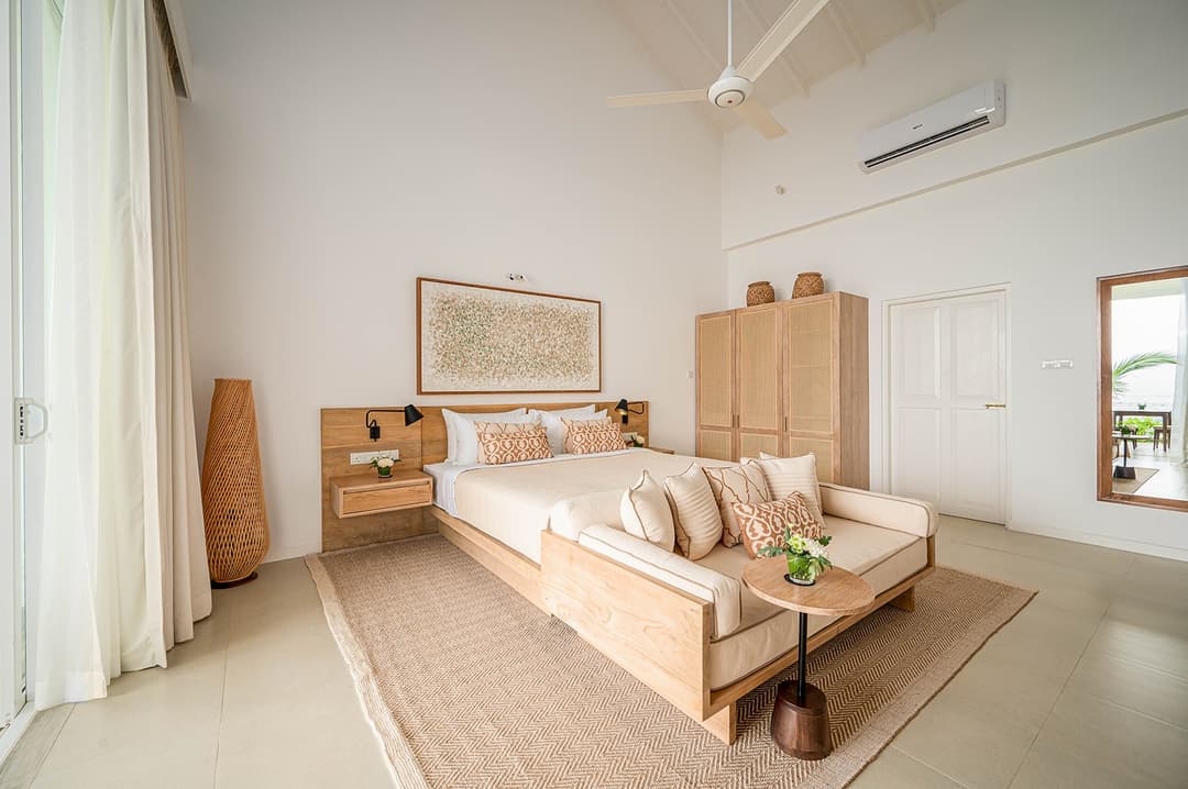 Mirissa luxury villa living room with ocean view and timber seating wide