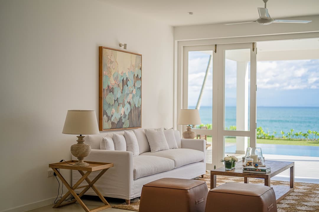 Mirissa luxury villa living room with white sofa, artwork and natural light