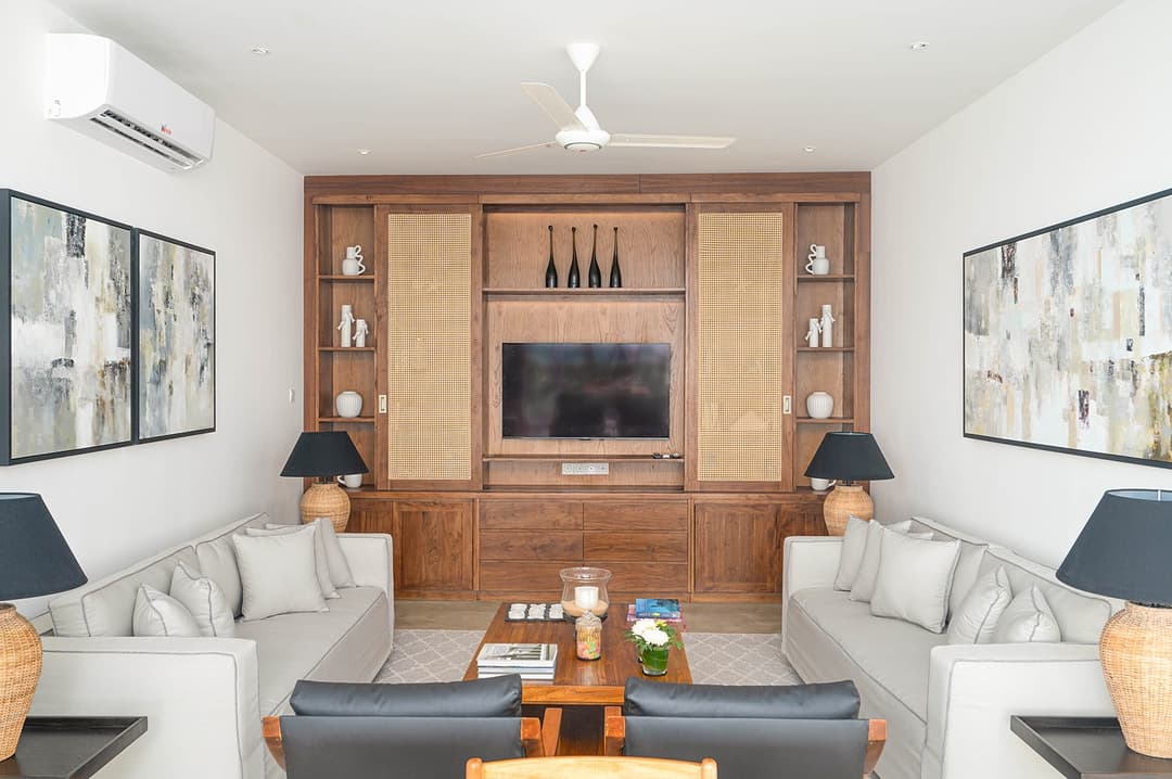 Mirissa luxury villa media room with white sofas and timber TV unit