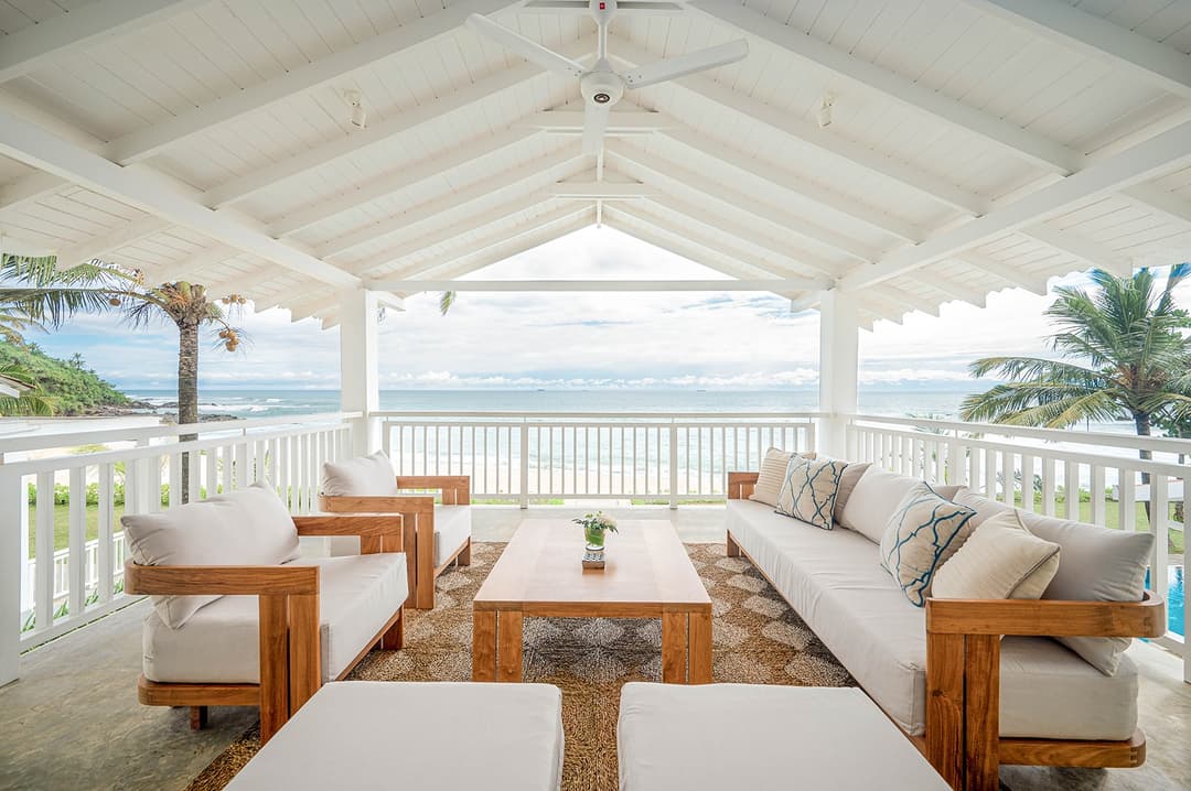 Mirissa luxury villa open pavilion with ocean view and white sofas
