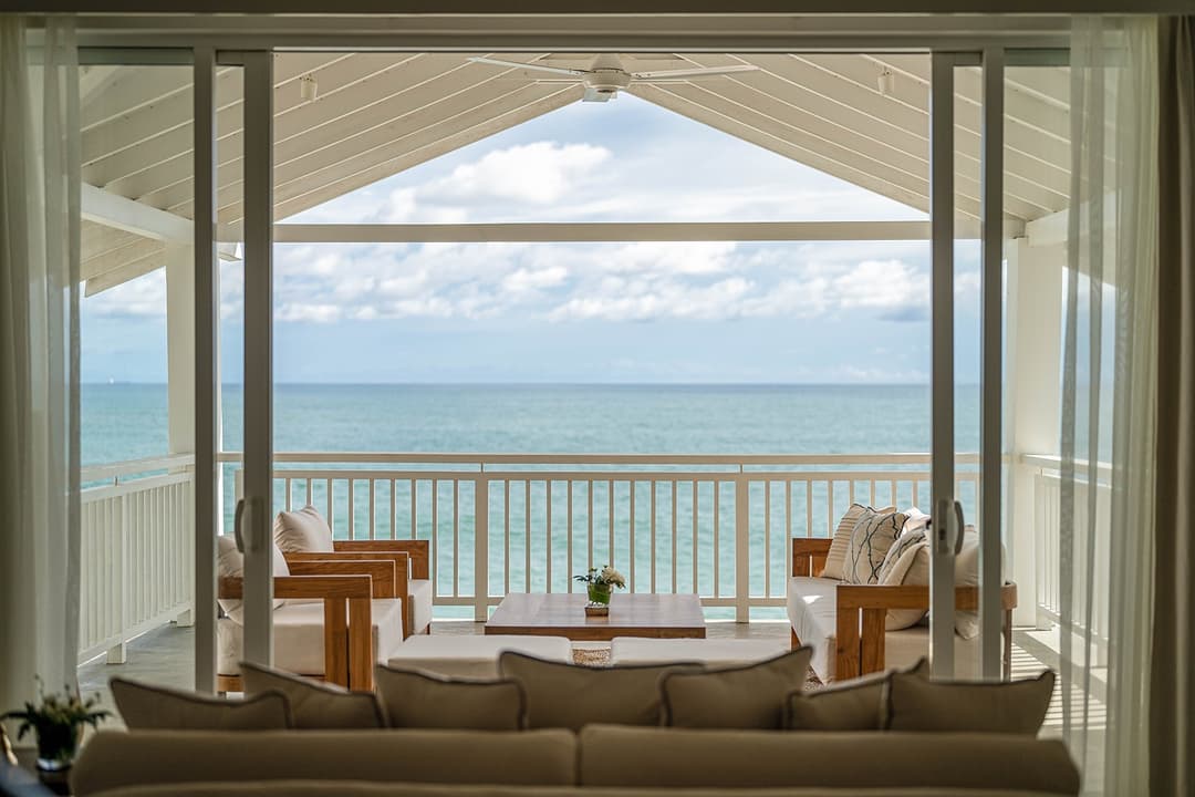 Mirissa luxury villa open terrace with ocean view and timber dining table