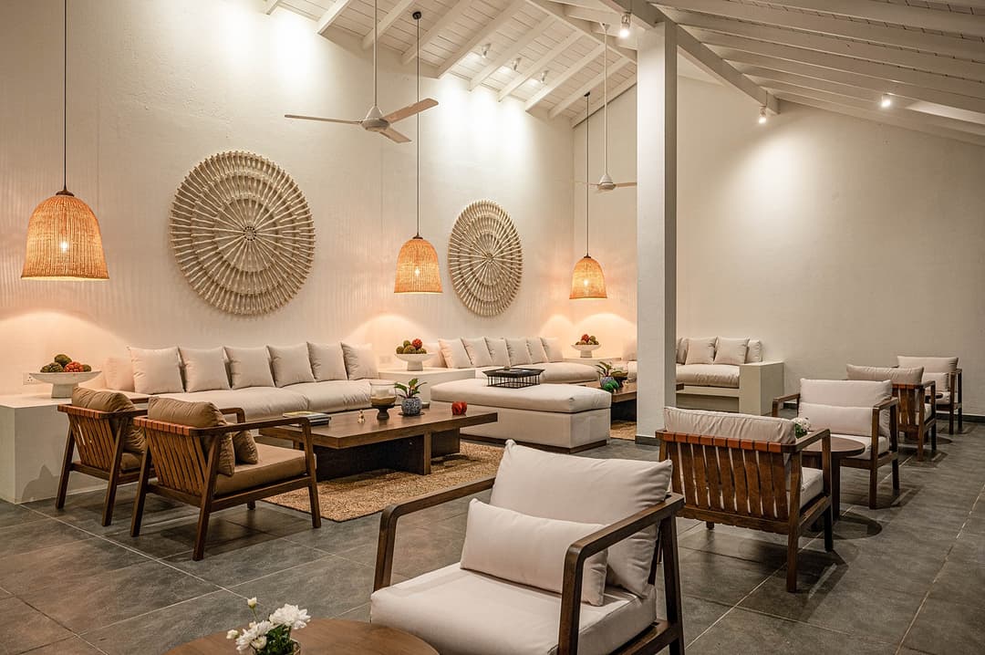 Mirissa luxury villa outdoor lounge seating with rattan pendants at night