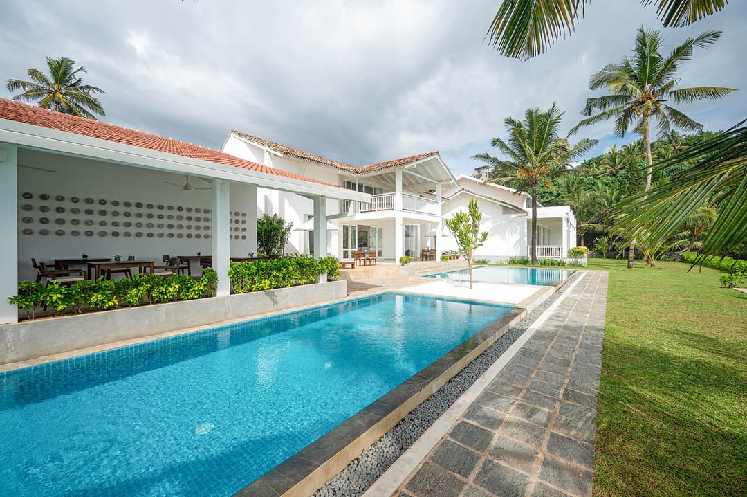 Sol House Mirissa wide angle exterior with pool and villa daytime
