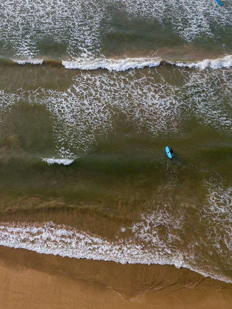 Aerial drone view of surf waves and beach at Matara Sri Lanka