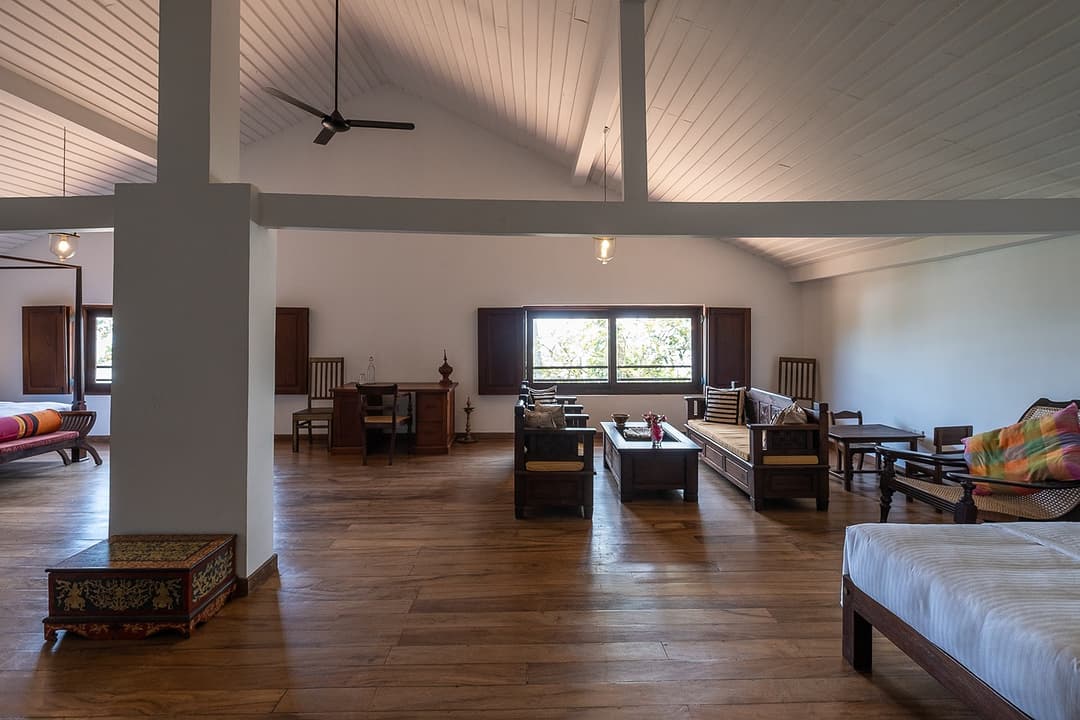 Matara villa loft bedroom wide view with high ceiling fan and twin beds