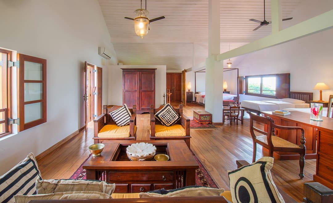 Matara villa loft bedroom and living area wide view with high ceiling