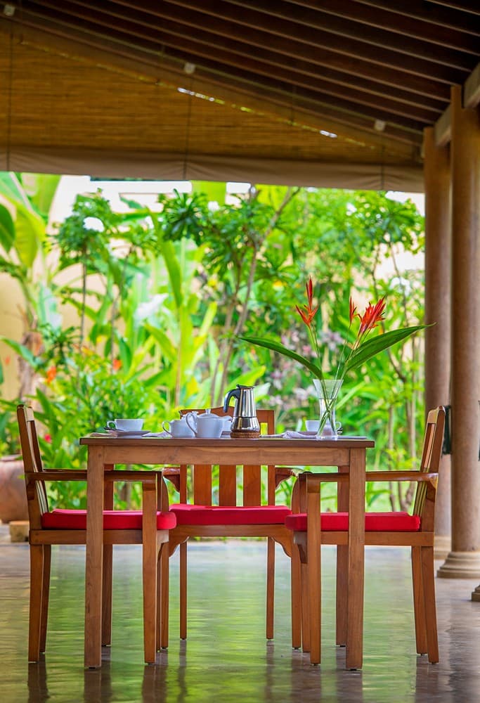 Matara villa outside table setting on veranda leading to courtyard room