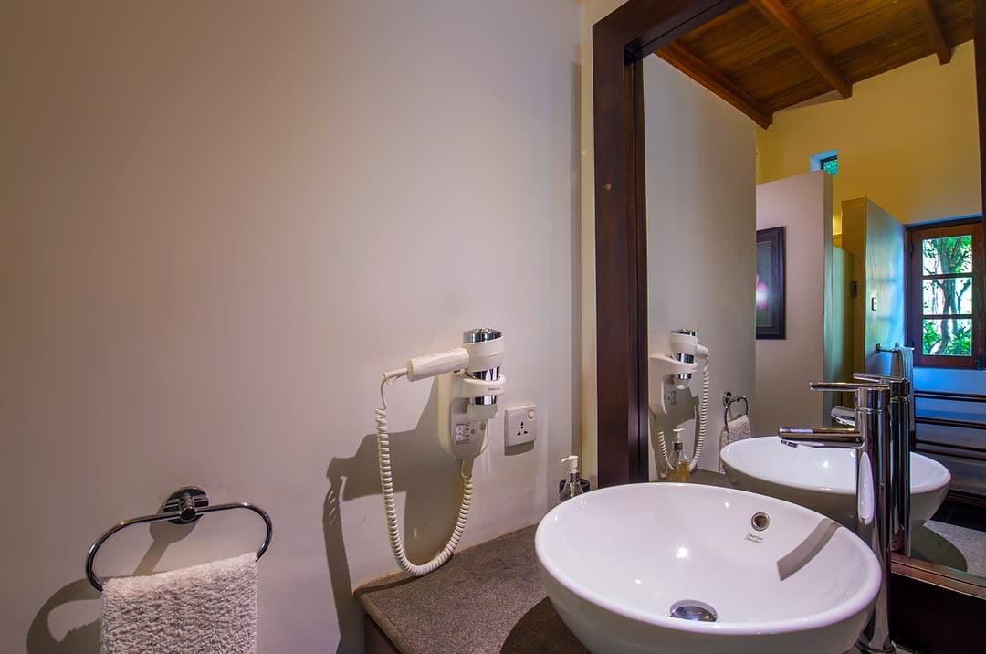 Matara villa poolside room bathroom with basin sink and window