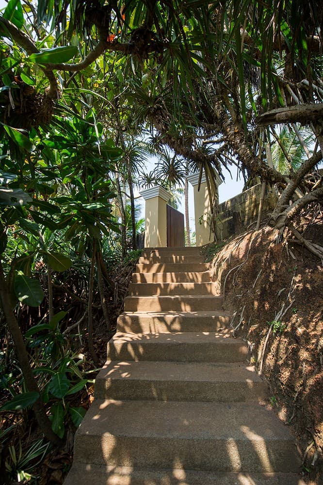 Matara villa private stone staircase through coconut grove to beach
