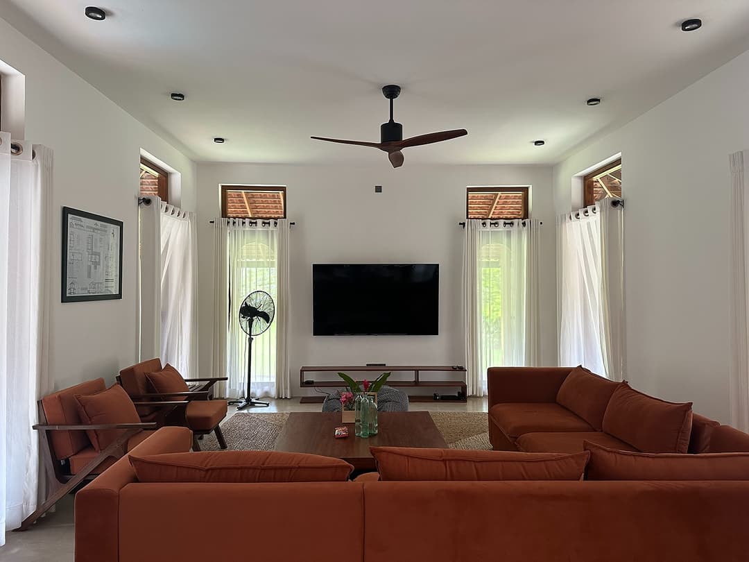 Villa living room and TV lounge with evening ambient lighting