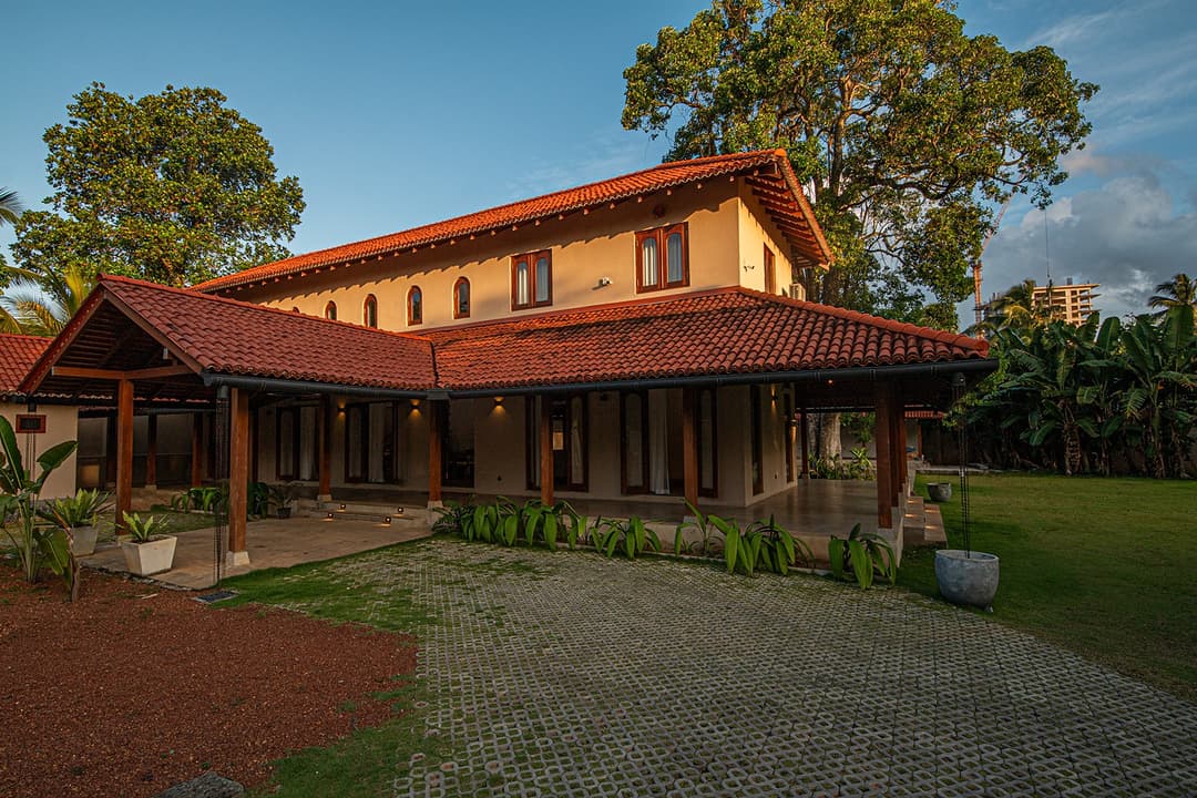Origin Balapitiya colonial facade with terracotta roof and lawn