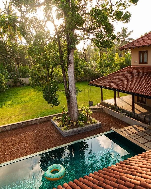 Origin Balapitiya saltwater pool alongside terracotta-roofed villa and garden
