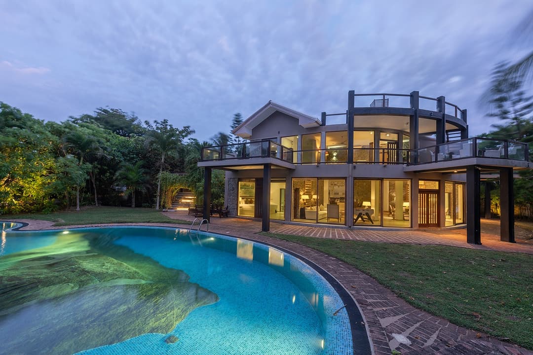 Casa Tua villa and pool illuminated at night