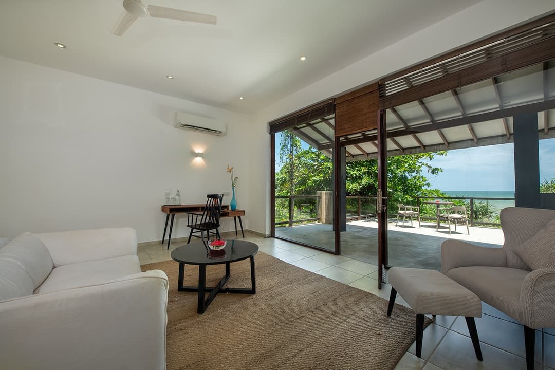 Upper lounge and TV room with ceiling fan and natural light