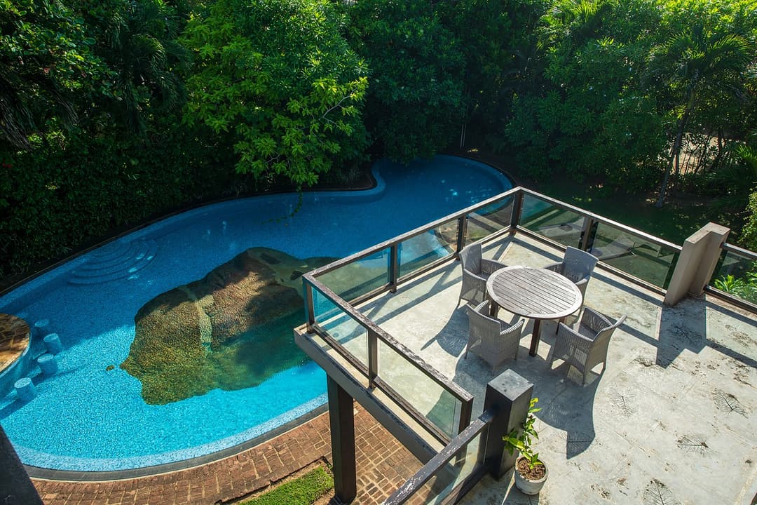 Villa terrace with ocean view and outdoor loungers