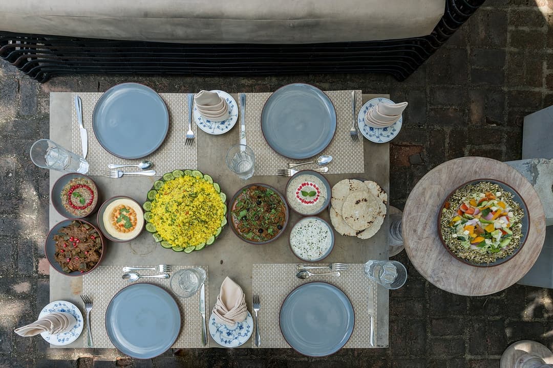 Sri Lankan feast spread viewed from above on wooden table