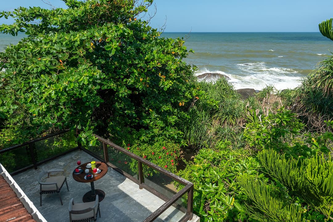 Ocean view and sandy beach from tropical coastal villa