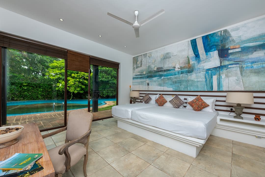 Villa living room with coastal artwork and ocean light