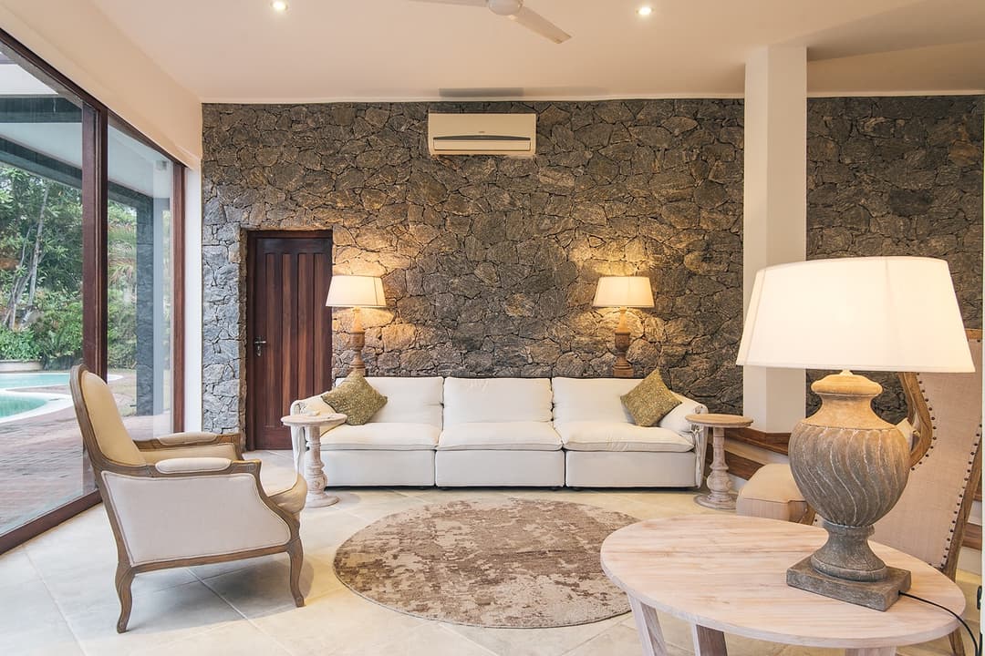 Villa bedroom with twin bedside lamps and warm tones