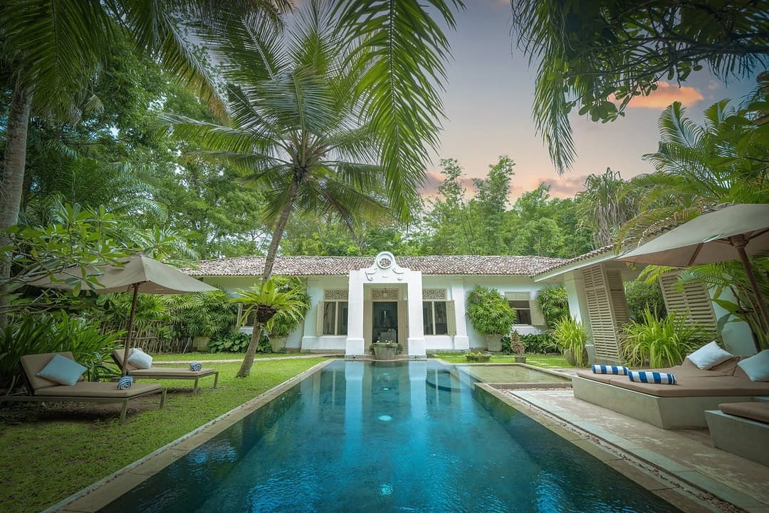 Rivers Edge villa and pool at dusk with tropical garden