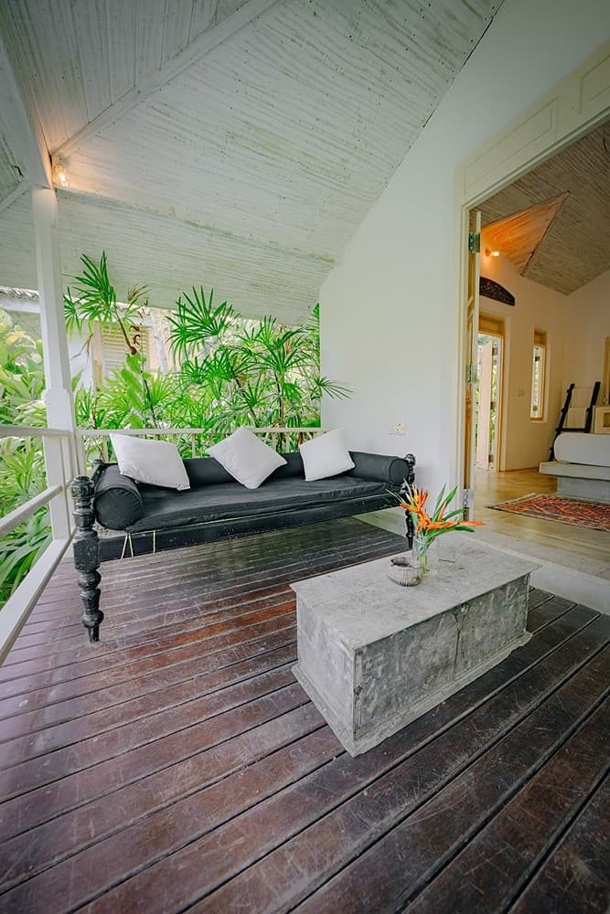 Rivers Edge veranda with daybed on polished timber floor