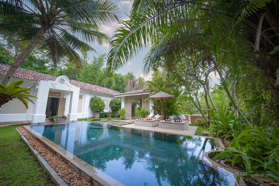 Rivers Edge pool and villa illuminated at evening