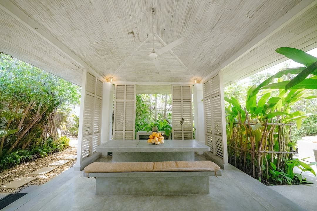 Villa bedroom with garden view and terrace access