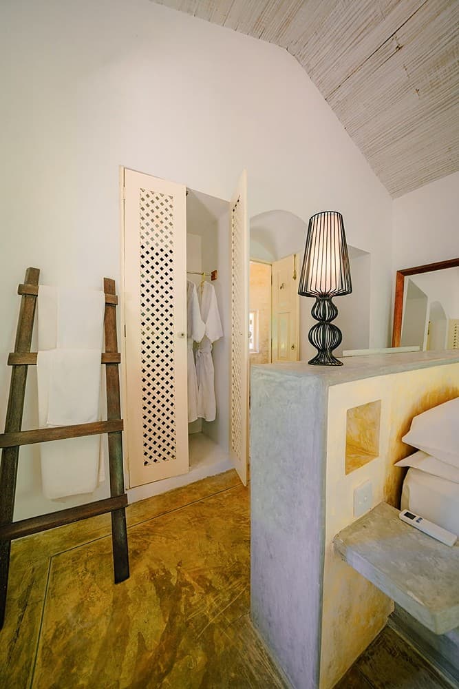 Villa bathroom with towel ladder and framed mirror