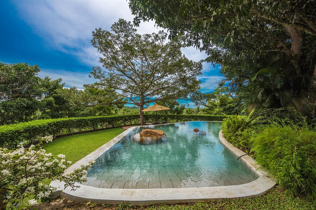 Kahanda Kanda Dubu honeymoon villa at sunset with pool
