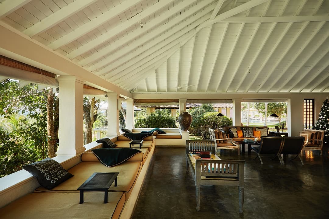 Lounge area with rattan seating and antique lamp