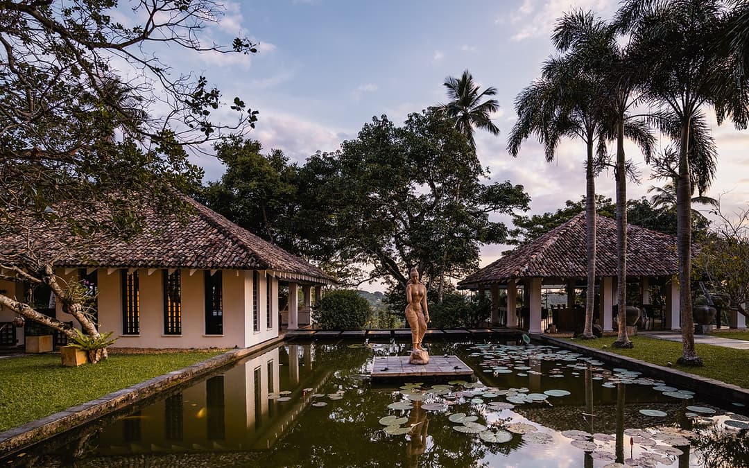 Kahanda Kanda villa exterior with pond and garden