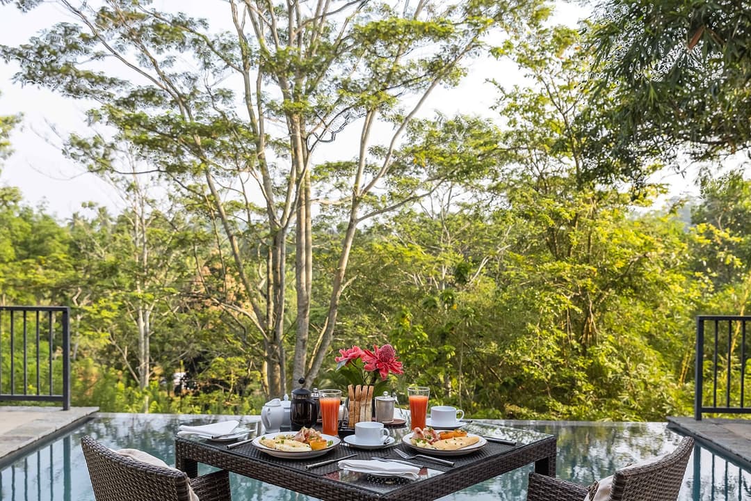 Kahanda Kanda outdoor dining with breakfast in tropical setting