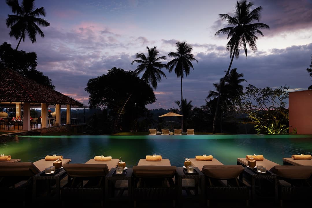 Kahanda Kanda infinity pool panoramic view illuminated during dusk