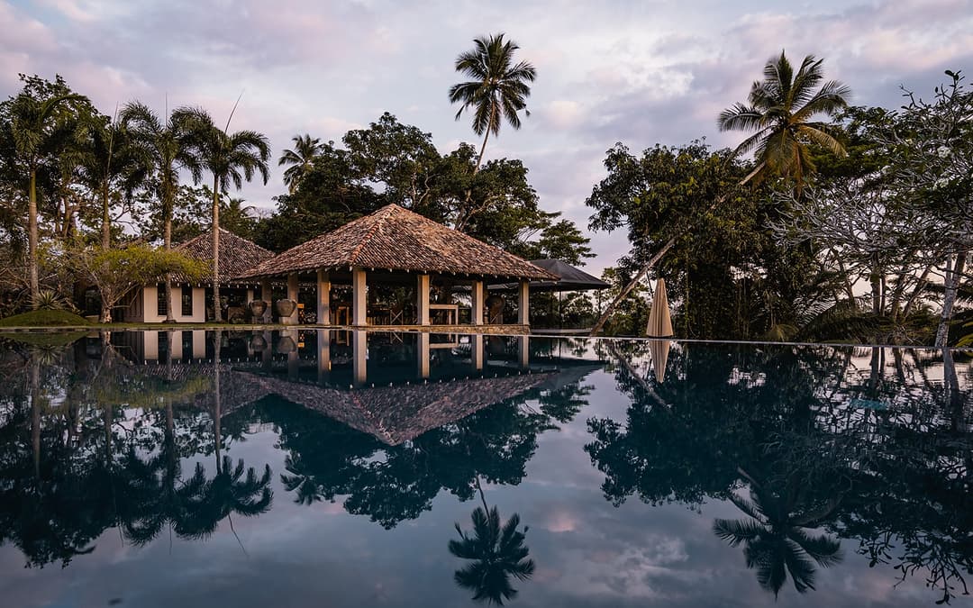 Kahanda Kanda pool edge with jungle canopy view beyond