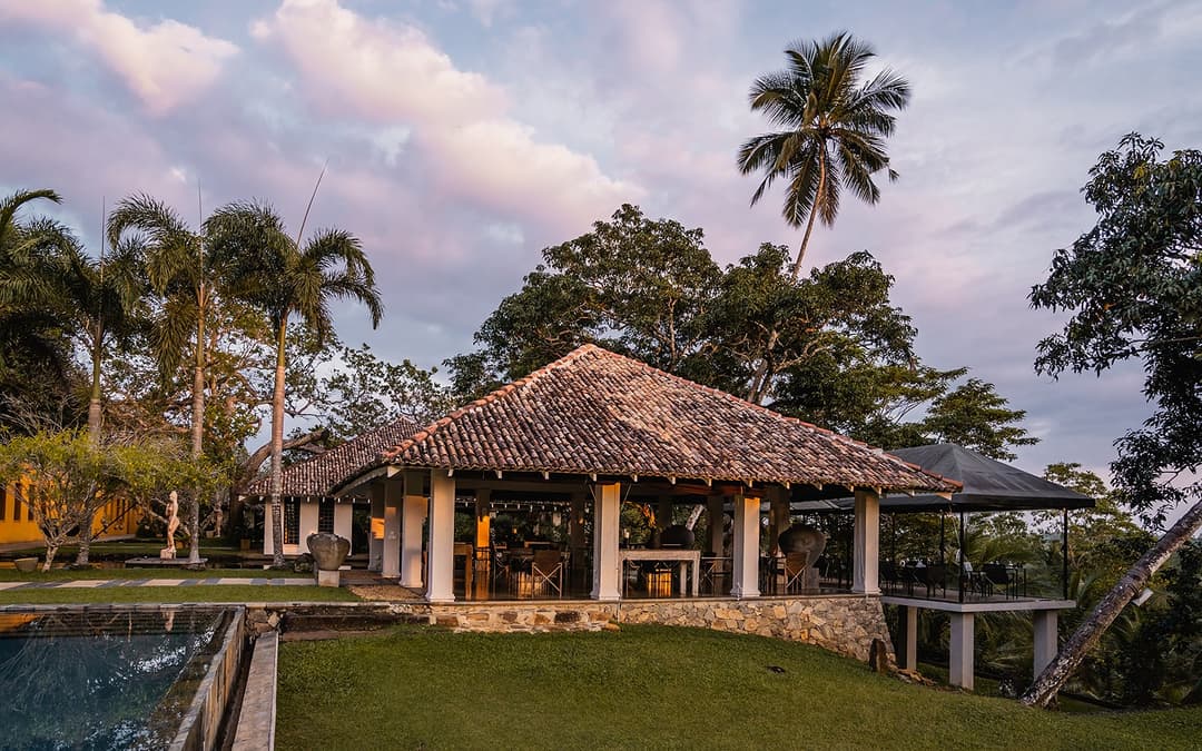 Kahanda Kanda entrance pavilion with palm trees and pool