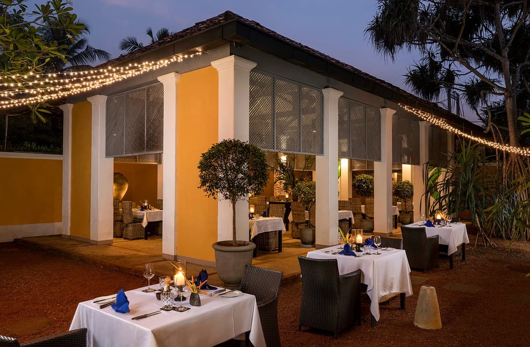 Restaurant set for dinner at Heritage House Bentota with warm lighting and colonial interiors