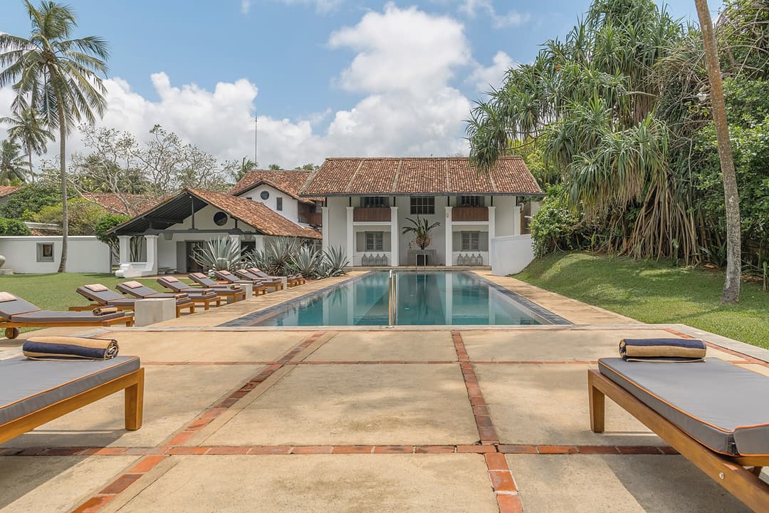 Heritage House Bentota pool with dramatic agave garden bed and Bawa-designed architecture