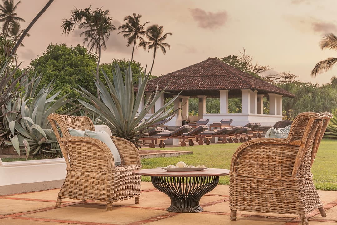 Heritage House Bentota colonial exterior viewed across the tropical garden lawns