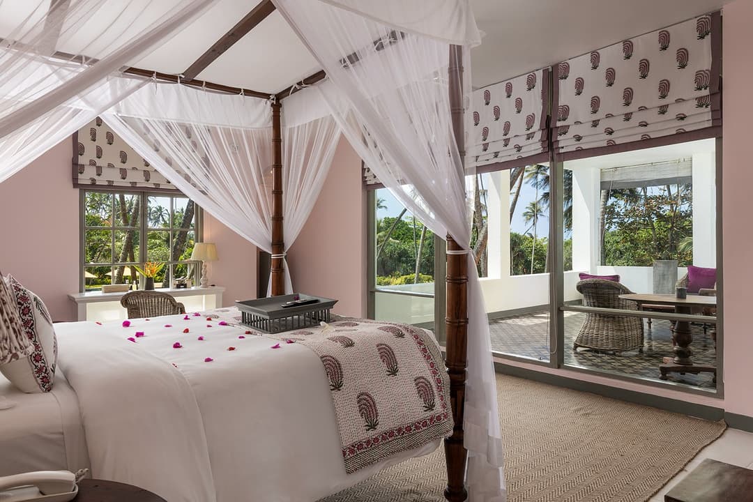 Well-lit canopy bedroom with television wall at Heritage House Bentota, Bentota, Sri Lanka