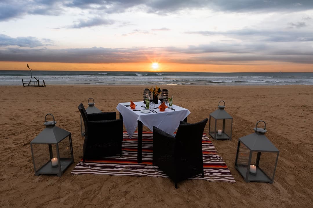 Couple on Bentota beach at dusk, Indian Ocean coastline directly from Heritage House