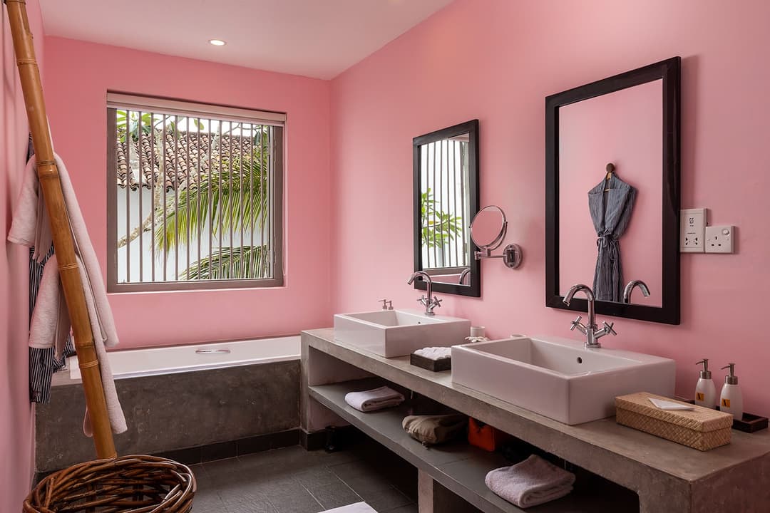 Twin stone vanity bathroom with rain shower at Heritage House Bentota, Bentota, Sri Lanka