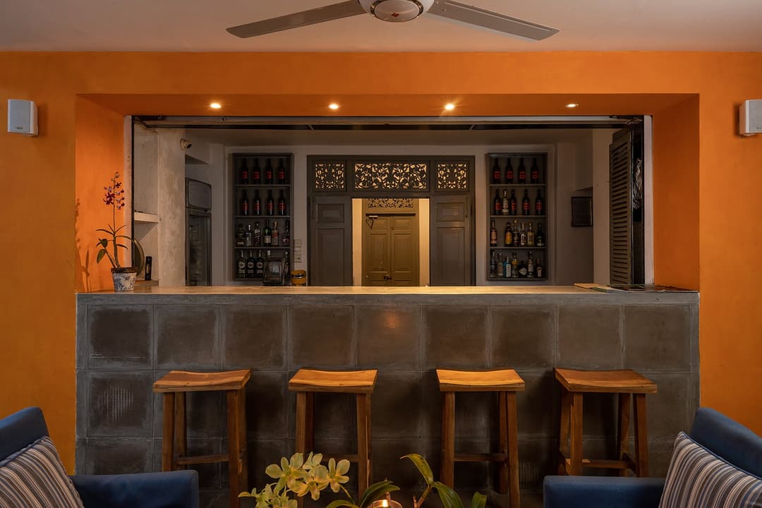Bar interior at Heritage House Bentota with vintage-style seating and Sri Lankan artwork