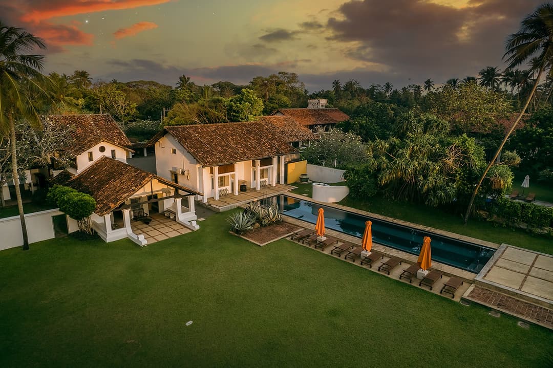 Overhead aerial of Heritage House Bentota pool with geometric sunlounger arrangement