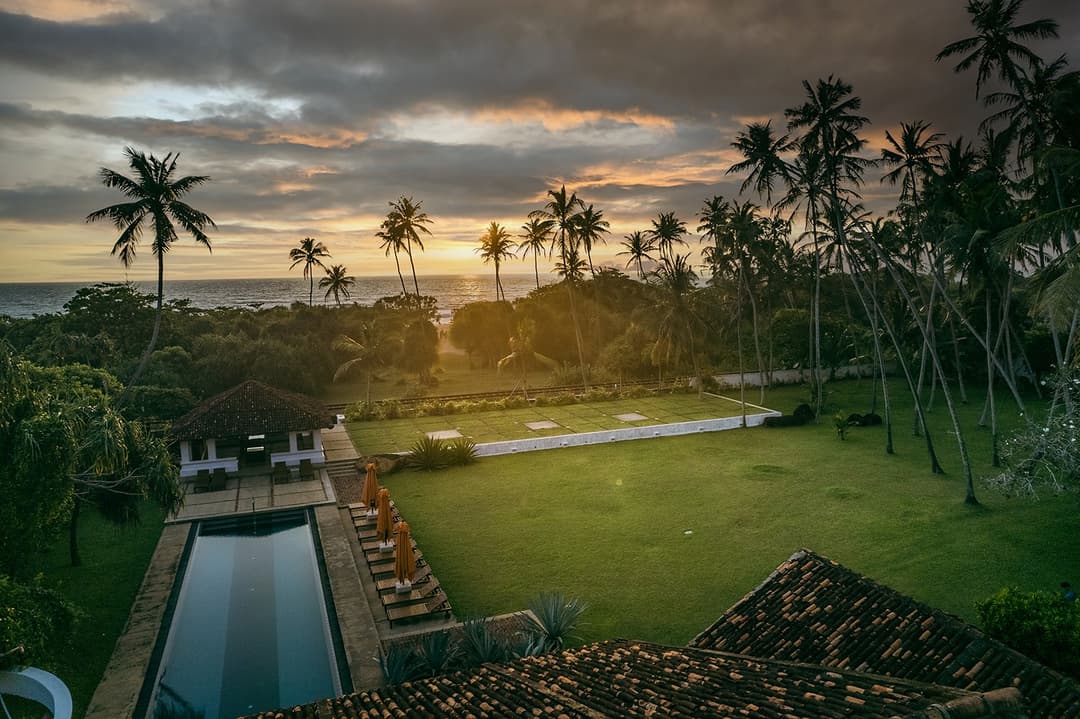 Wide aerial overview of Heritage House Bentota showing beachfront location and estate grounds