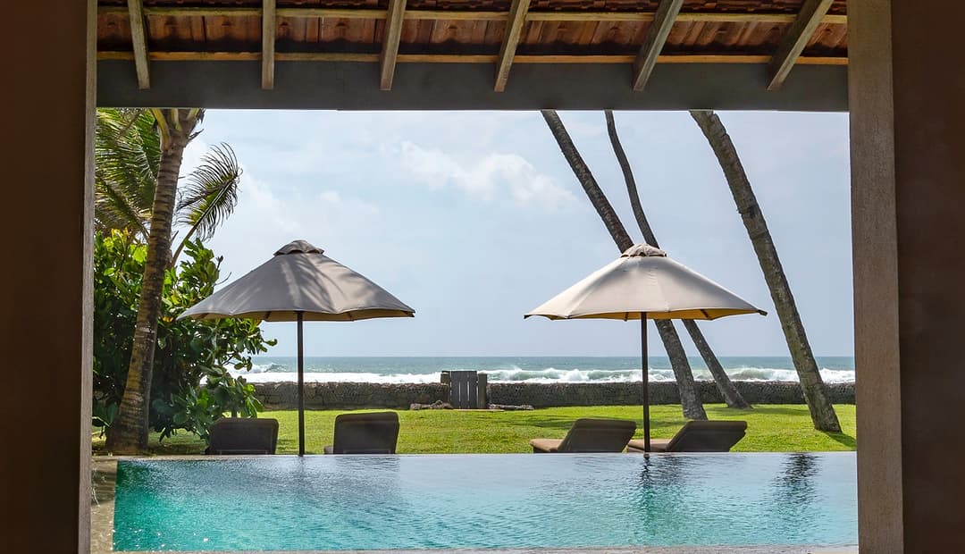 Cottage Kabalana pool panoramic with thatched pavilion and Indian Ocean, Ahangama