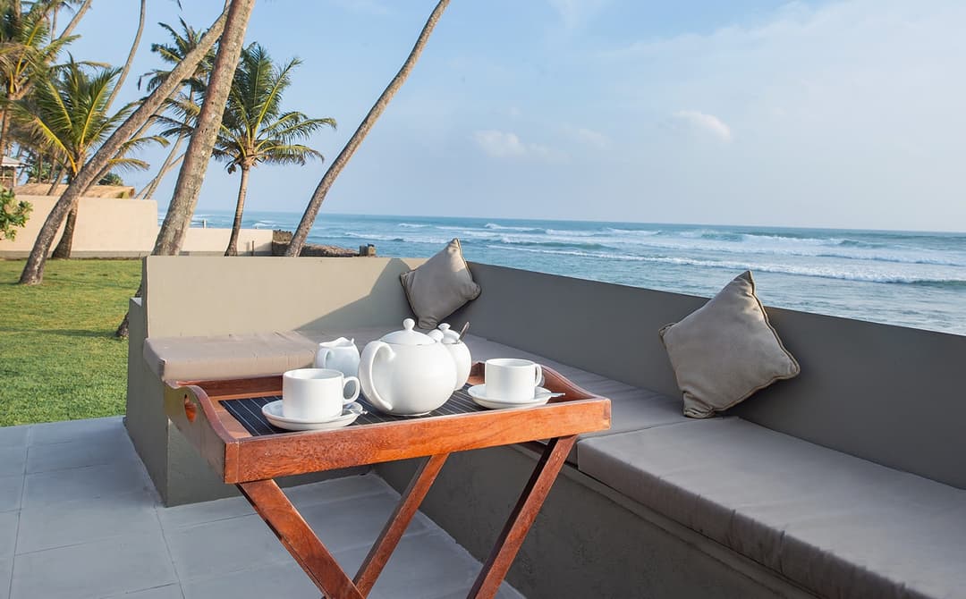 Oceanfront pavilion seating with Indian Ocean views at Cottage Kabalana, Ahangama