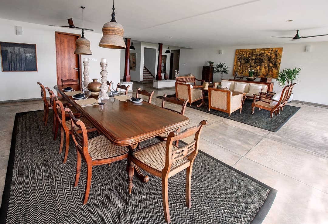 Dining room with pendant lighting and garden views at Cottage Kabalana, Ahangama, Sri Lanka